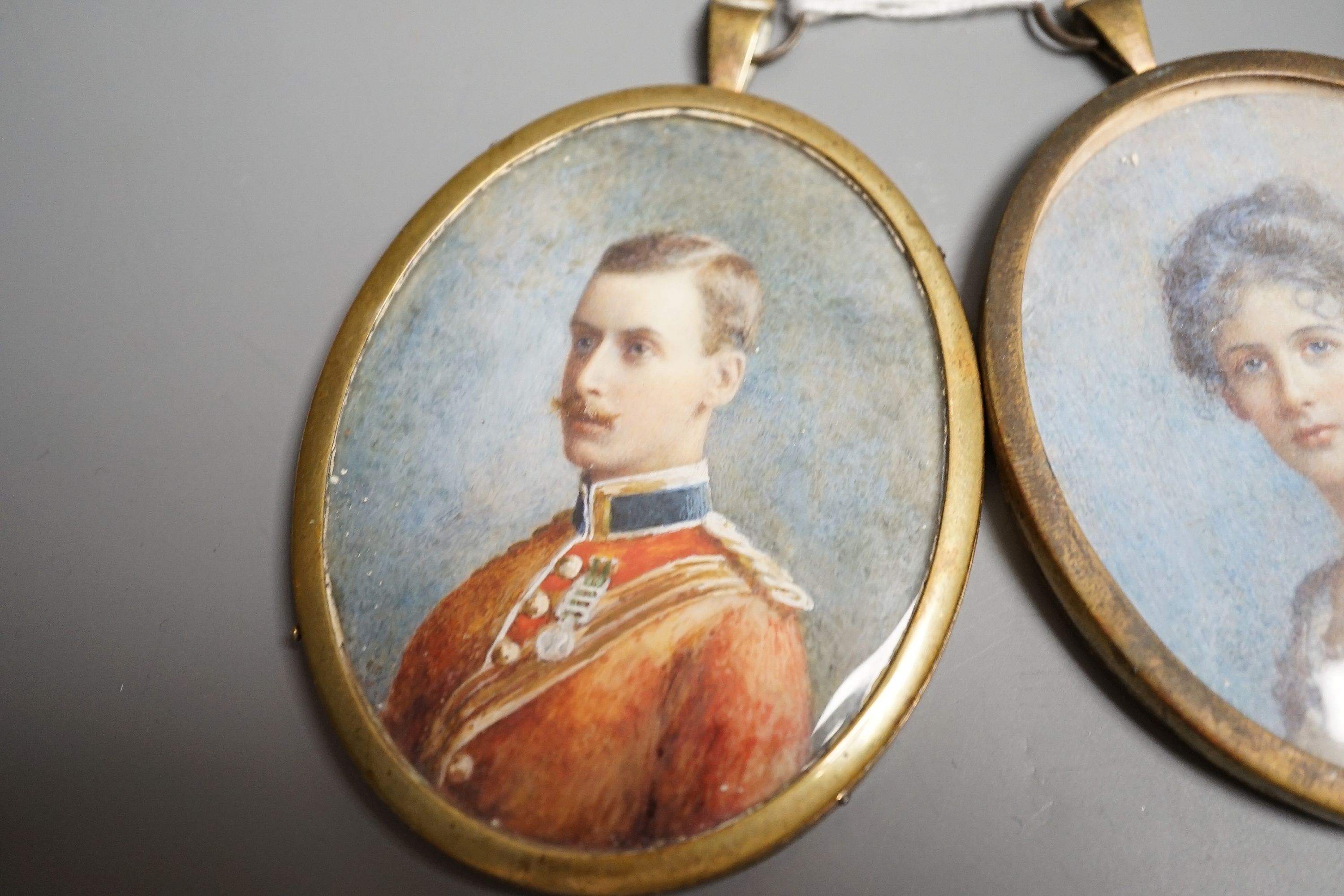 Two Edwardian portrait miniatures on ivory, one of a lady, the other an officer, height 8cm